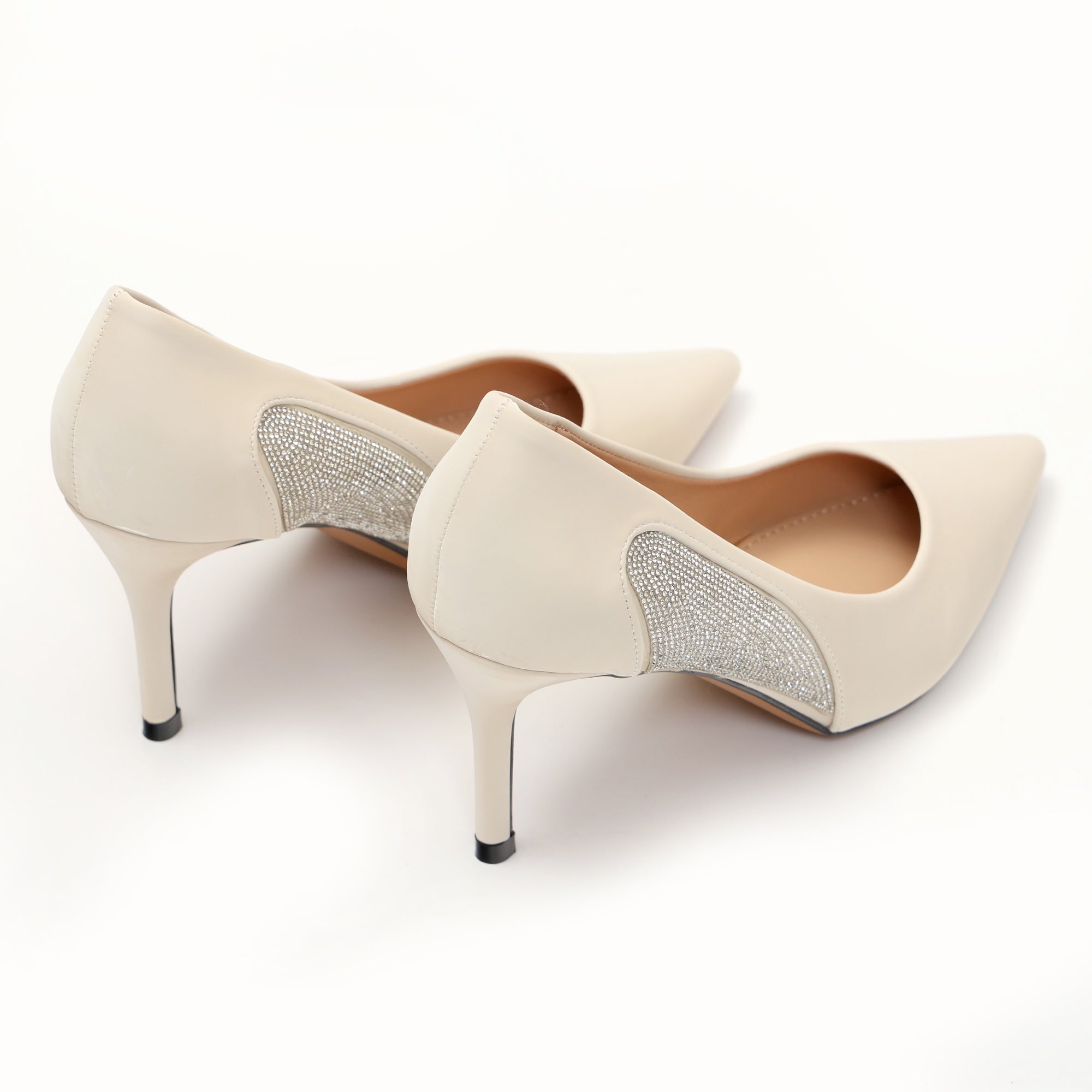 Dècolletè pumps in simil pelle verniciata con strass laterali Beige